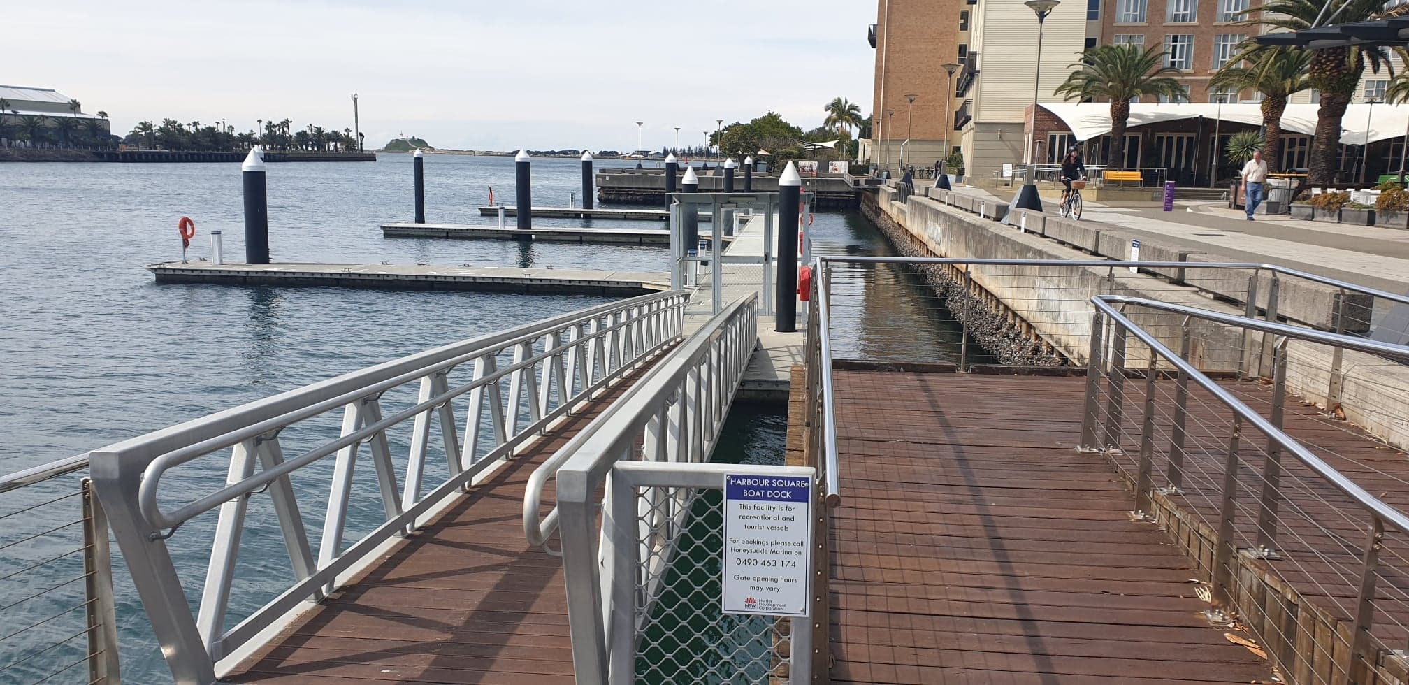 Harbour Square Boat Dock sign with berth booking phone number